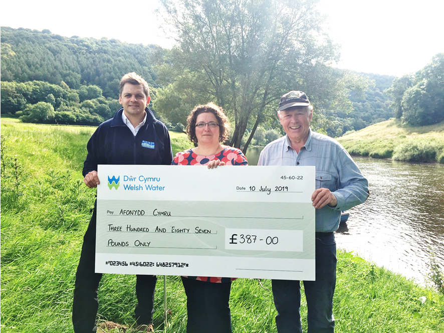APEM and Welsh Water handover cheque to Afonydd Cymru