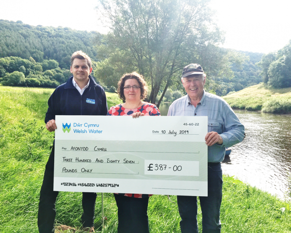 APEM and Welsh Water handover cheque to Afonydd Cymru