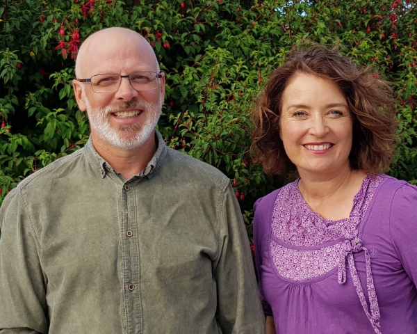 Will and Sharon in front of a bush