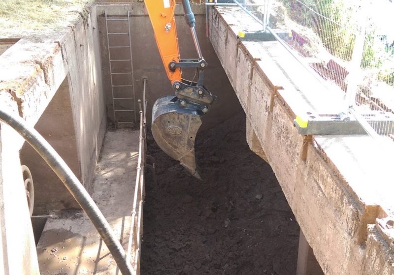 Sediment removal in process by a digger